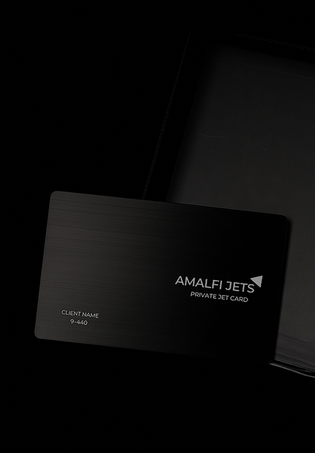 Sleek floating image of the Amalfi Jets private jet card outside of a black briefcase.
