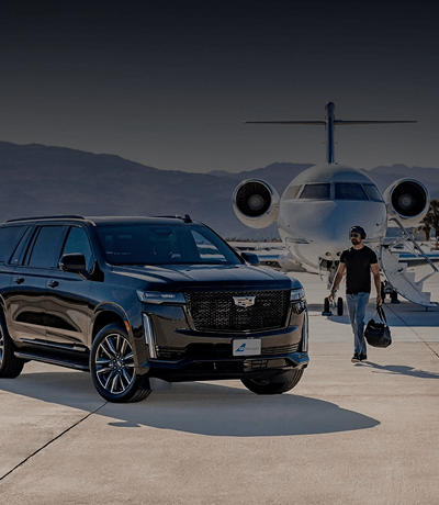 Man walking towards a Black Cadillac Escalade parked on the tarmac outside a Private Jet for Black Car Service.