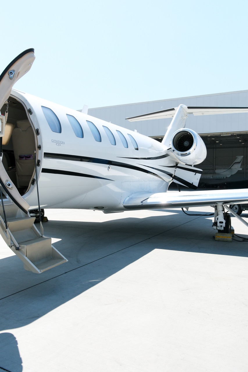 Cessna Citation CJ3 light jet exterior on tarmac with cabin stairs open, seating up to eight passengers.