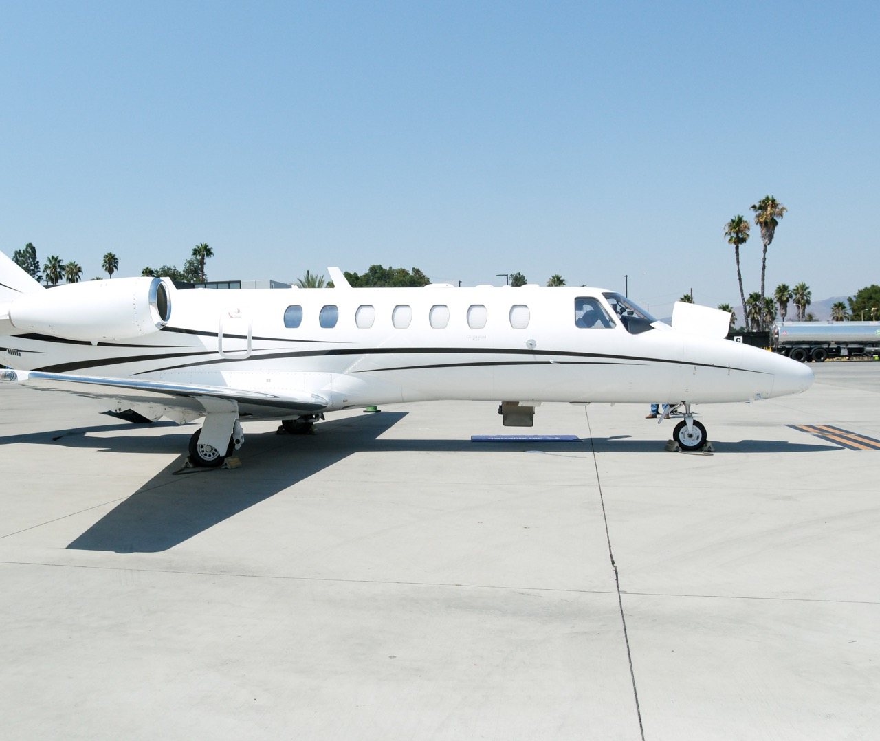 Cessna Citation CJ3 exterior parked on tarmac, elegant design and twin engines ready for private travel.