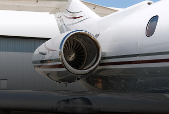 Cessna Citation X private jet with gleaming engine and silver trim parked on the tarmac for Amalfi Jets’ on-demand charter.